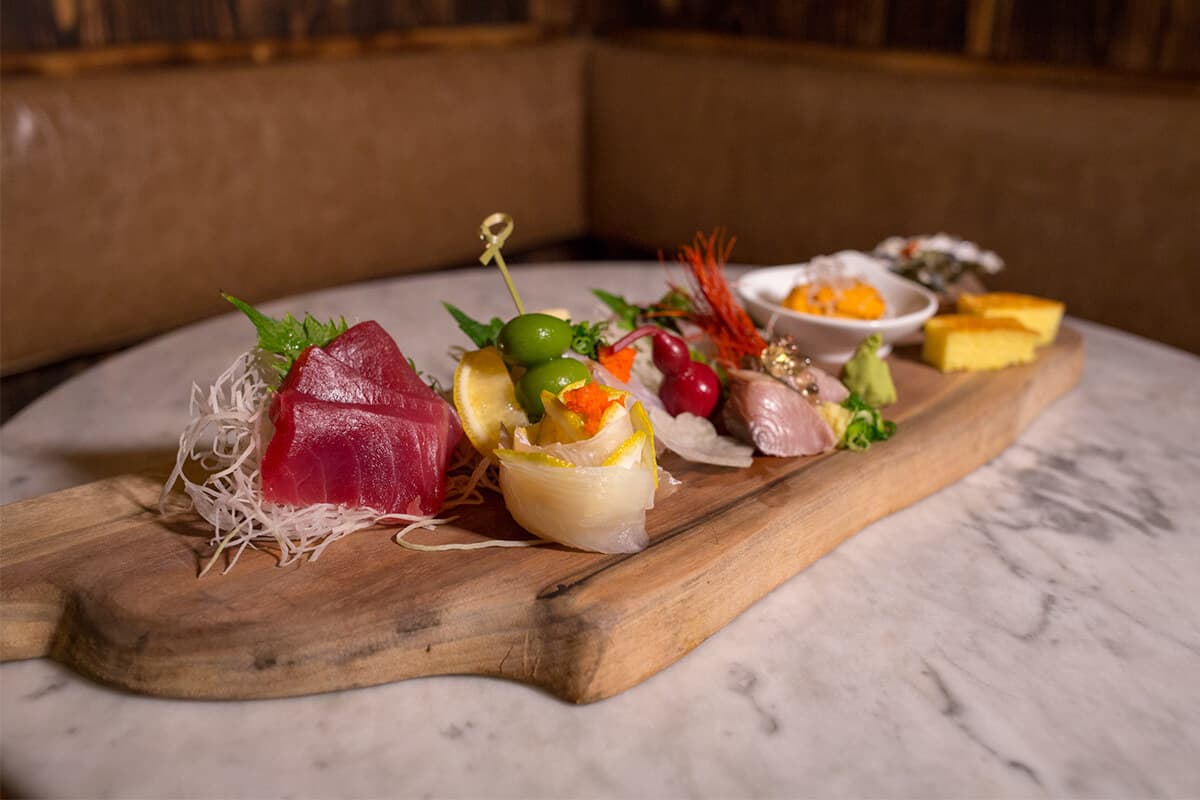 Image of assorted sushi platter on wooden board